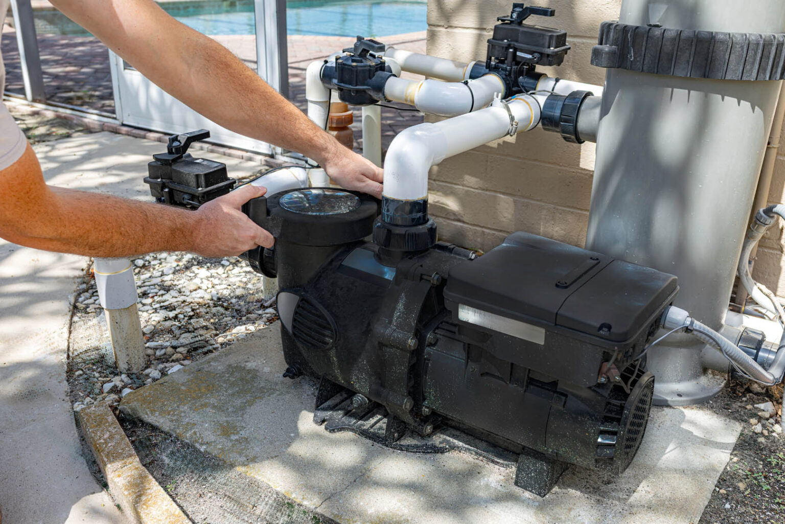 Close-up horizontal view of a technician's hands installing or s